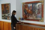 Embassy intern poses with the artworks "Man on a Bull" and "Odalisque of the Grand Canal" by artist Theo Tobiasse at the Embassy of Lithuania in London